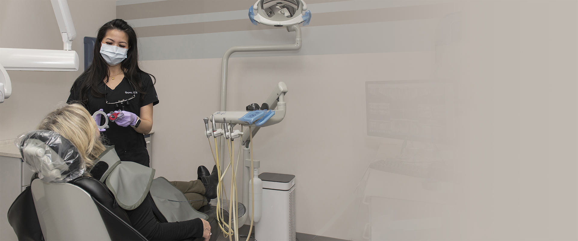 Hygenist Quyen with a patient